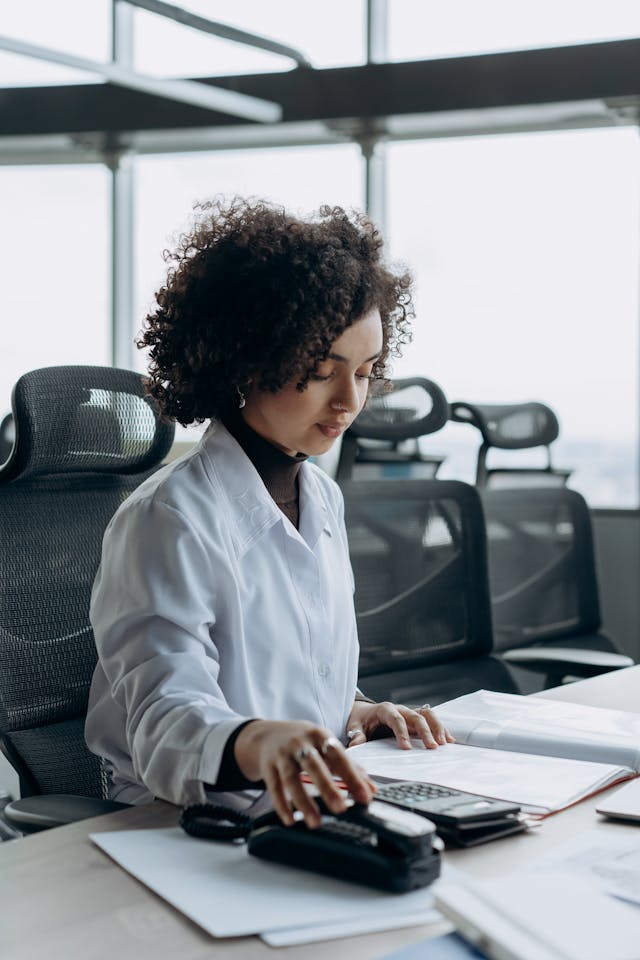 Professional woman working at desk in modern office environment